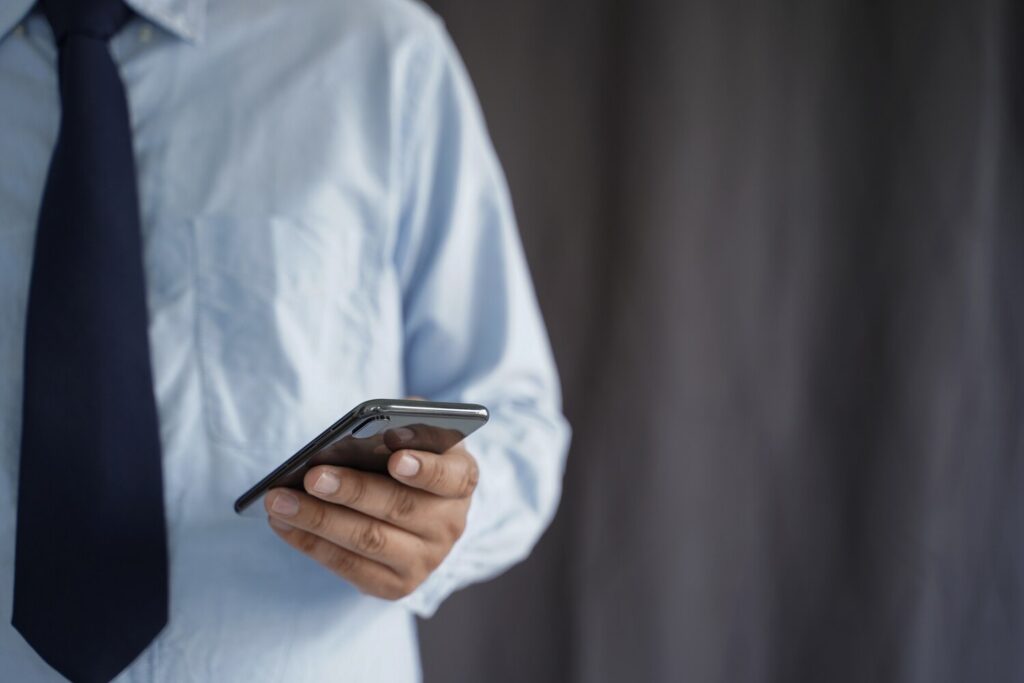 business man hold smartphone street copy space 36325 1453