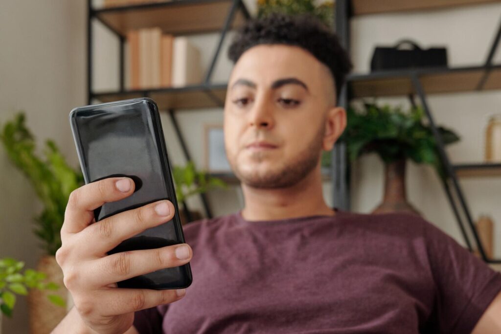 angry young man reading news social media answering text messages 274689 28549