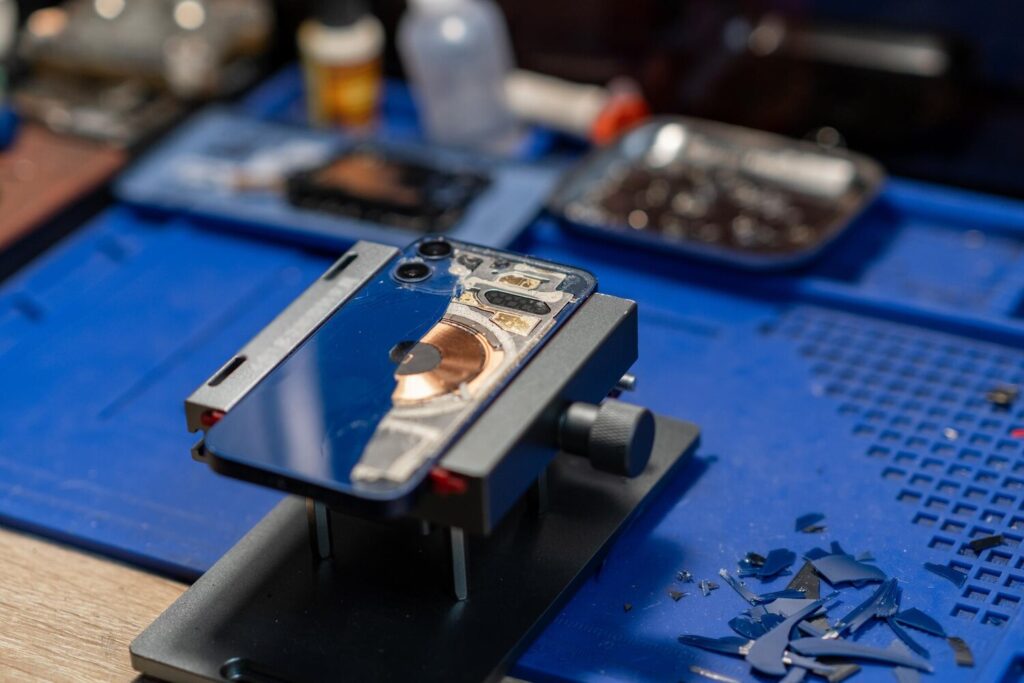 repairing smartphone back glass image shows technician working phone 262708 68463 repairing smartphone back glass image shows technician working phone 262708 68463